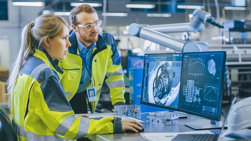 Engineer examining 3D printed part.